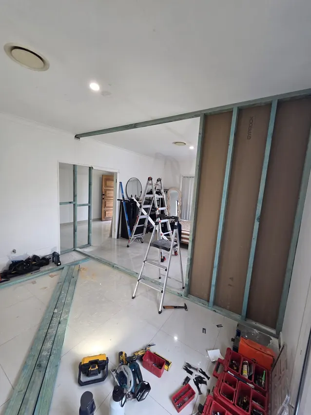 A new dividing wall taking shape during a bedroom renovation in Auburn.