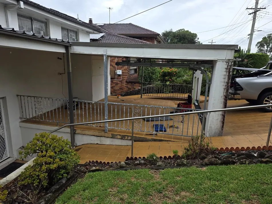 Carport ramp and railing before the job