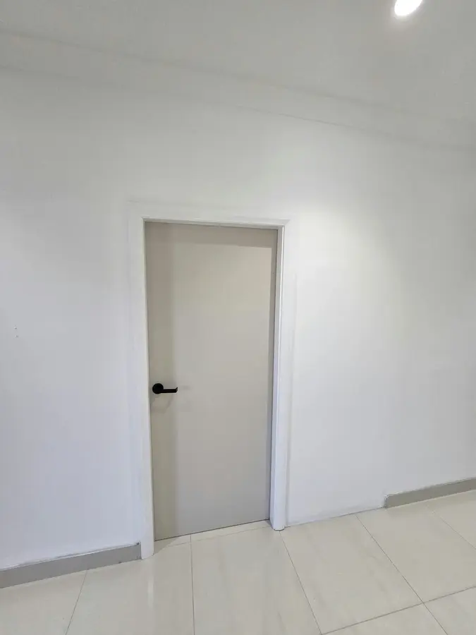 Doorway & Wall Reconfiguration: double doorway reduced to single door, new dividing wall framed — kitchen, bedroom and hallway remodel