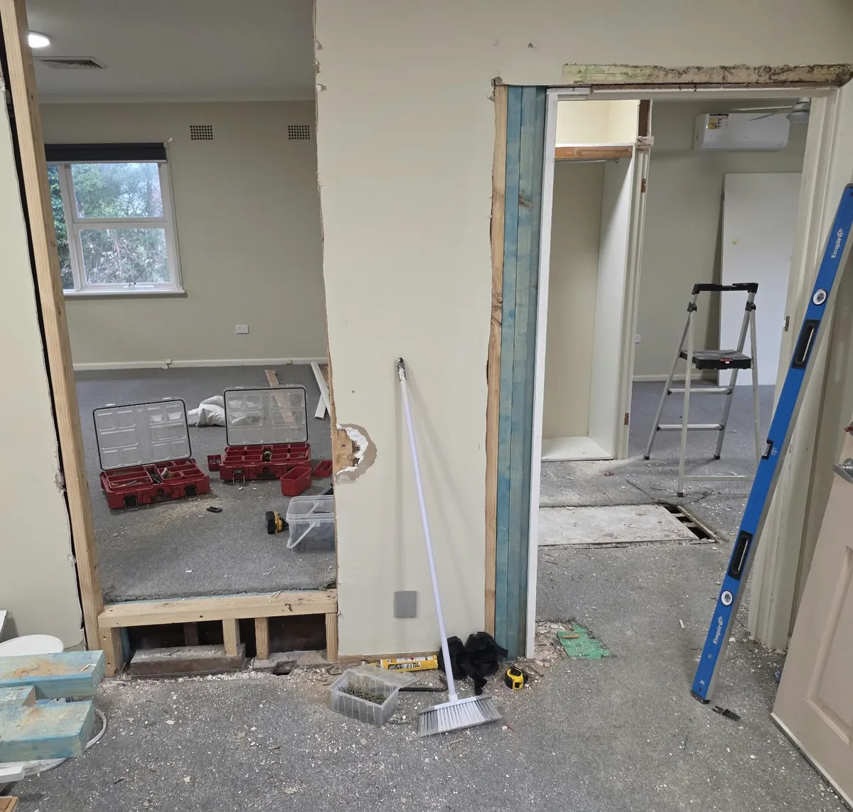 Full renovation before: walls opened up and reframed for new doorways