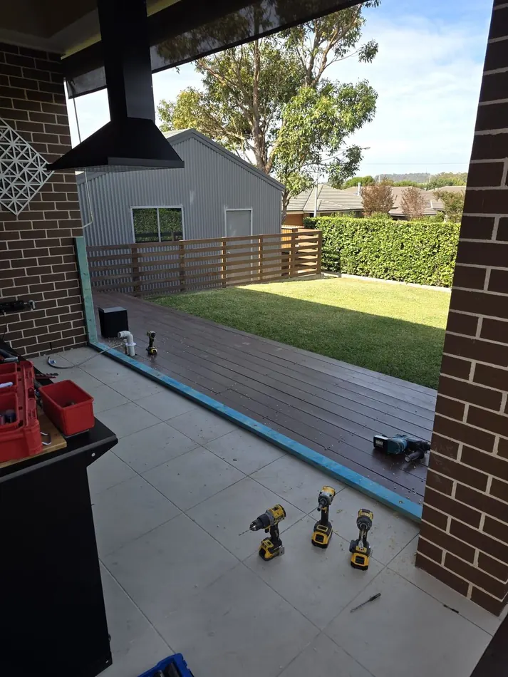 Unfinished patio and deck area before the job