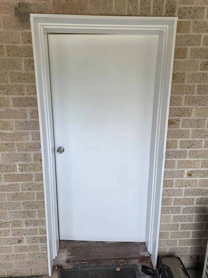 Accessible Doorway Widening: brick opening widened, new lintel installed and a wider door and frame fitted for wheelchair access