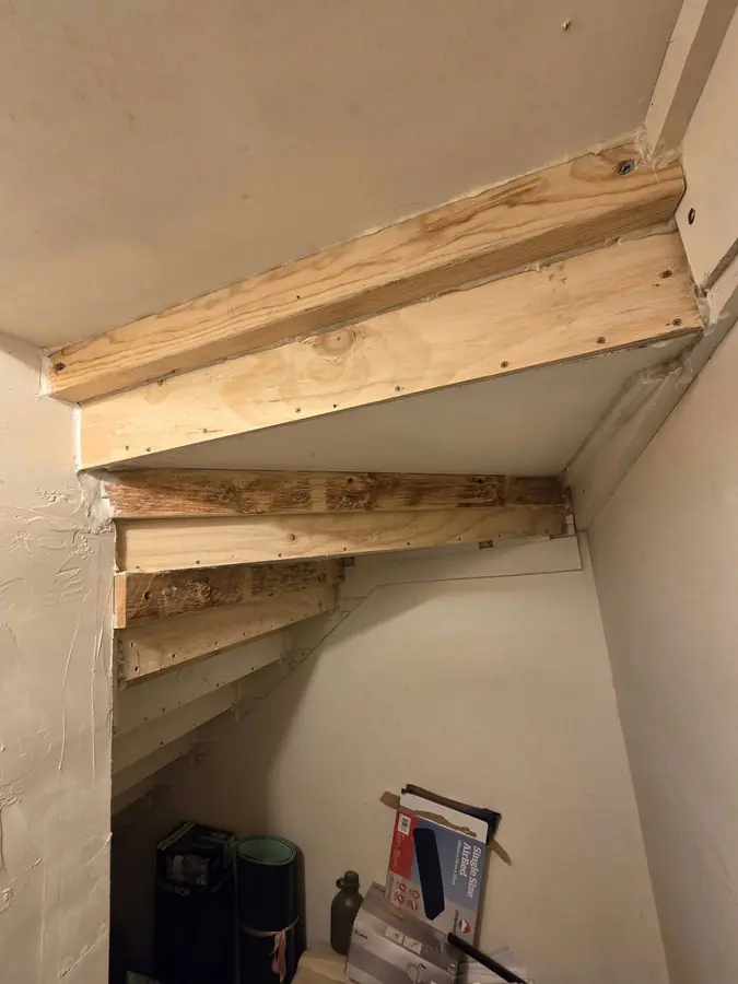 Heavy Staircase Reinforcement: structural timber framing under heavy staircase